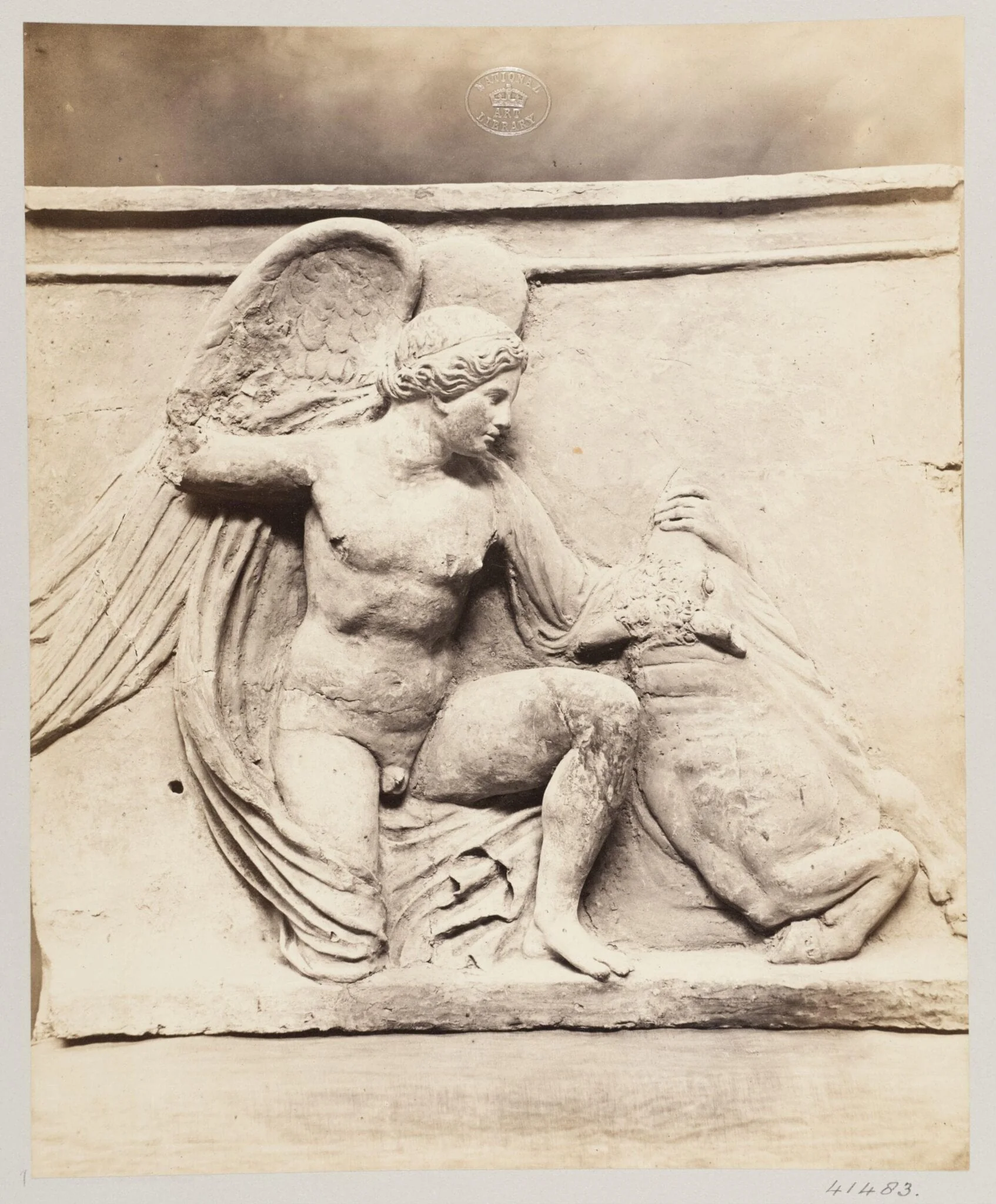 Winged figure slaying a bull in terra cotta, detail