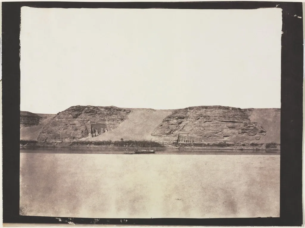 General View of Monuments Carved into Bedrock with Photographer's Dahabieh. Abu Simbel, by Félix Teynard, 1852