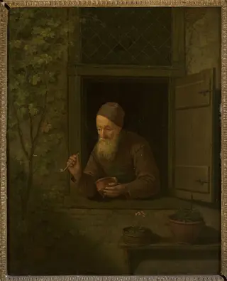 Old man with a pipe in the window