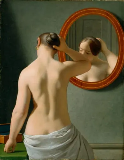 A nude woman doing her hair before a mirror, by http://viaf.org/viaf/56884667