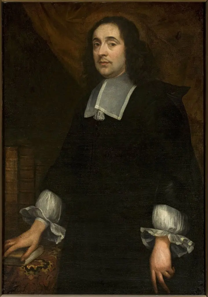 Portrait of a man at the table covered with a carpet, by Jan de Baen