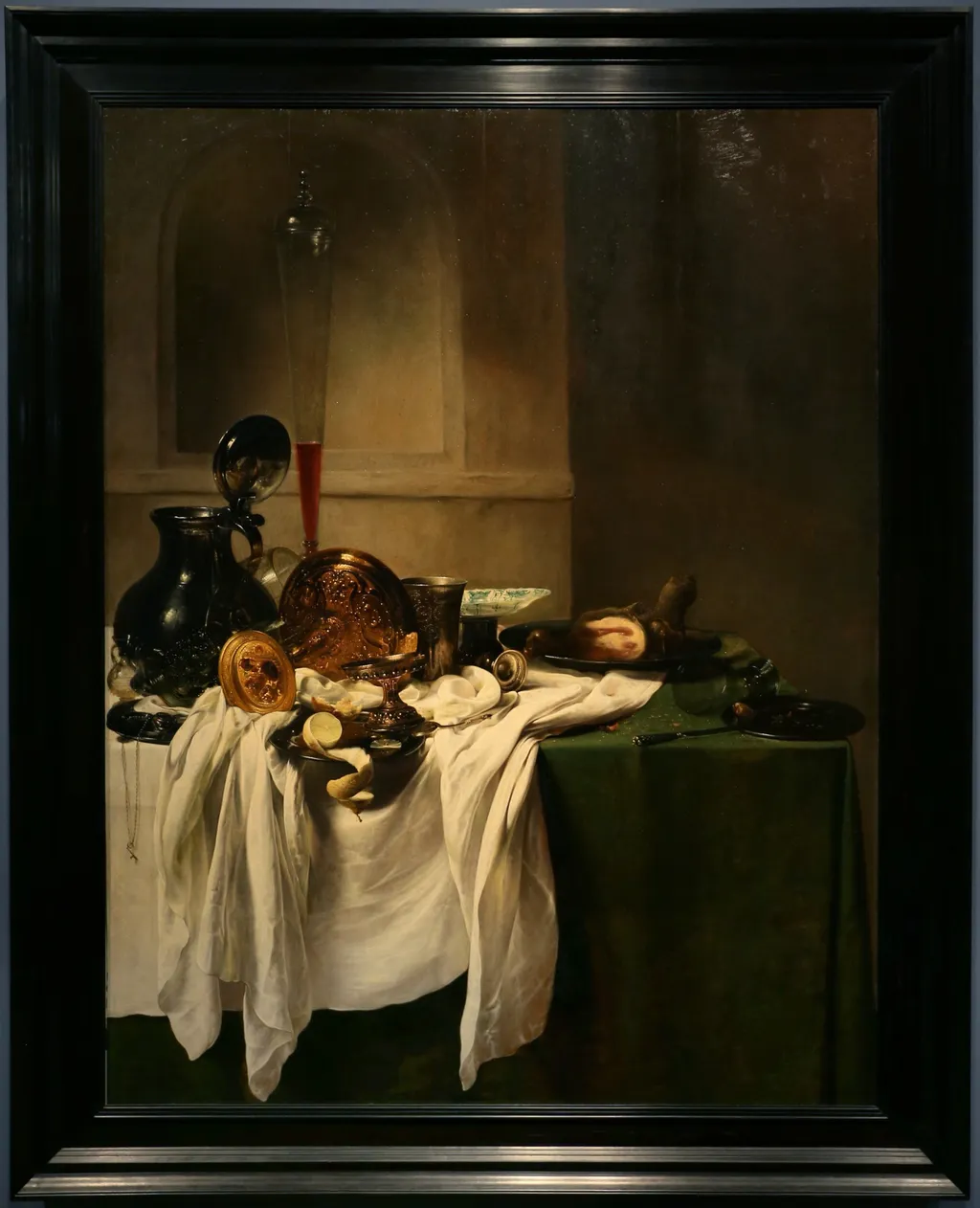 Still life of a laid table with ham and a view of a niche, by Jan Jansz den Uyl, paint, 1635