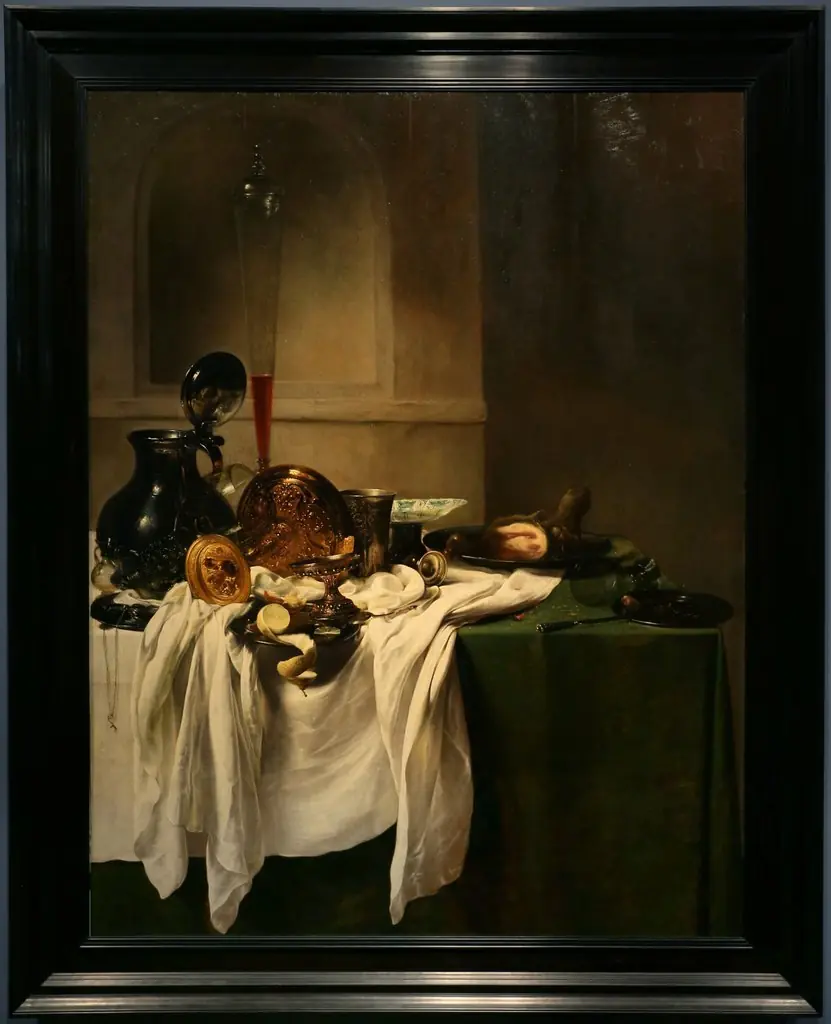 Still life of a laid table with ham and a view of a niche
