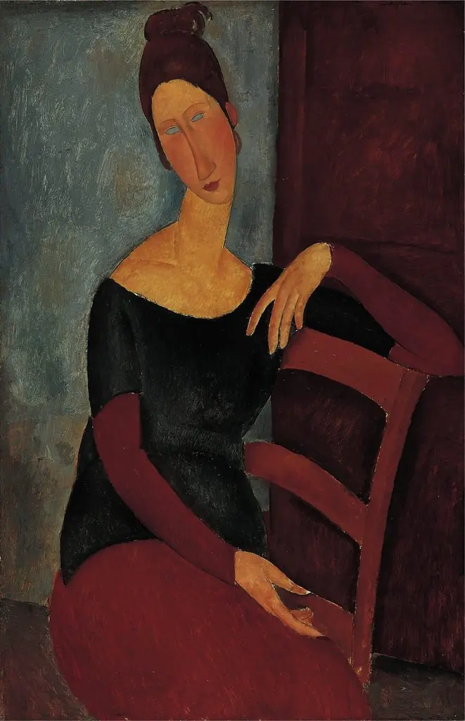 Jeanne seated with the arm resting on the back of the chair