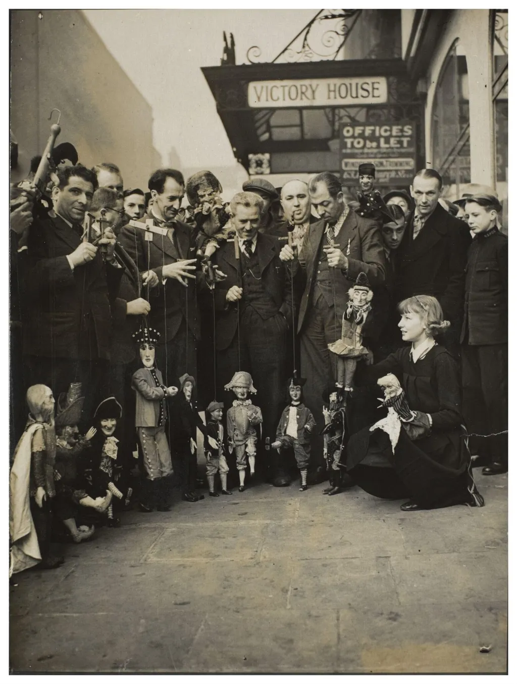 Photograph of puppeteers at the opening of the 13th Exhibition of the British Puppet and Model Theatre Guild, 1938, by Keystone Press Agency Ltd., photographic, 1938