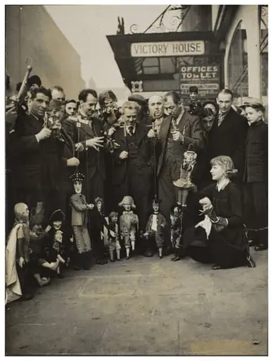 Photograph of puppeteers at the opening of the 13th Exhibition of the British Puppet and Model Theatre Guild, 1938, by Keystone Press Agency Ltd.