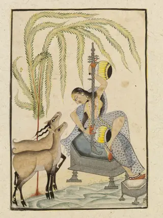 Lady playing on a vina