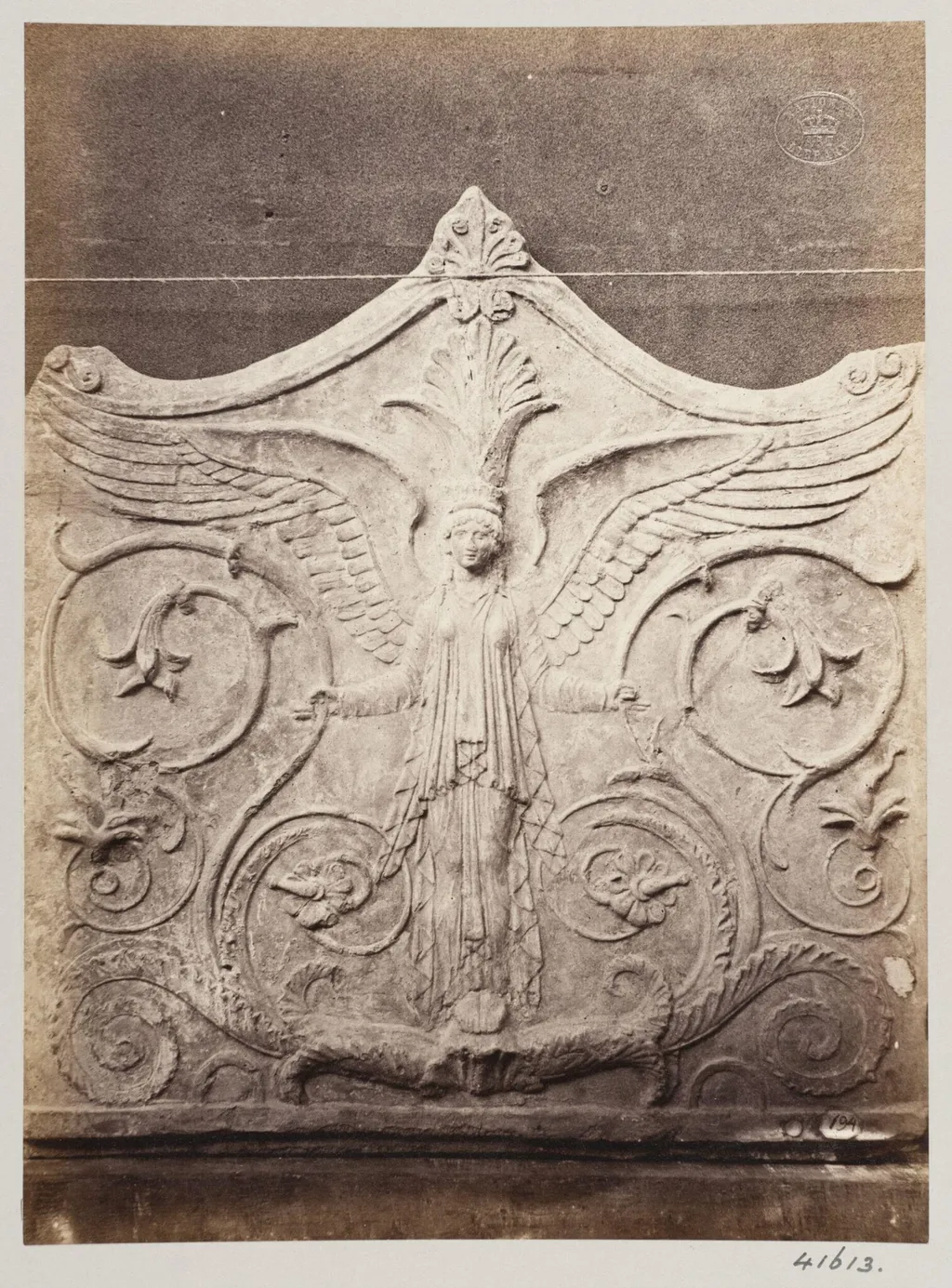 Bas-relief portion of a frieze of a winged figure with foliage in terra cotta, by Louise Laffon, photographic, 1864