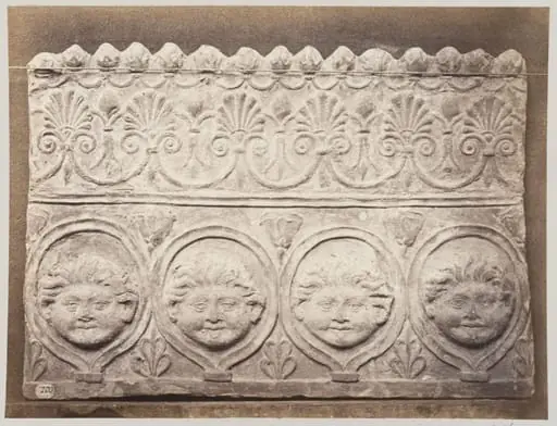 Bas-relief portion of a frieze of four masked young satyrs in terra cotta, by Louise Laffon