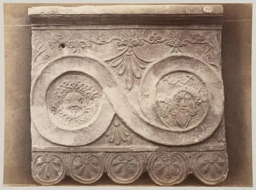 Bas-relief portion of a frieze of scrollwork with masks in terra cotta, by Louise Laffon