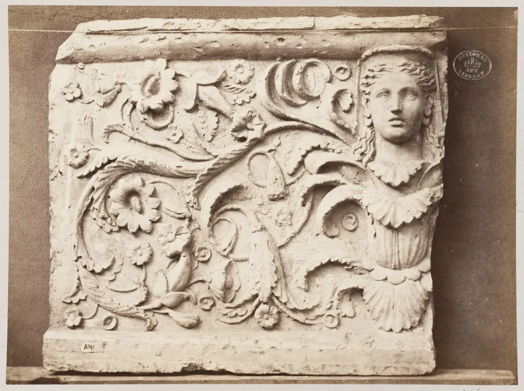 Bas-relief portion of frieze of female head and foliage ornament in terra cotta, by Louise Laffon, photographic, 1864