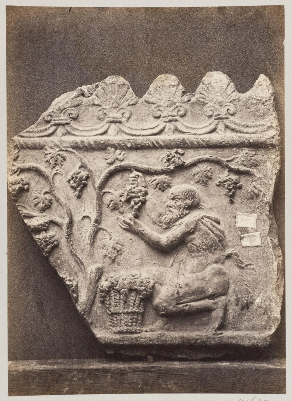Bas-relief portion of frieze with harvesting satyr in terra cotta, by Louise Laffon, photographic, 1864