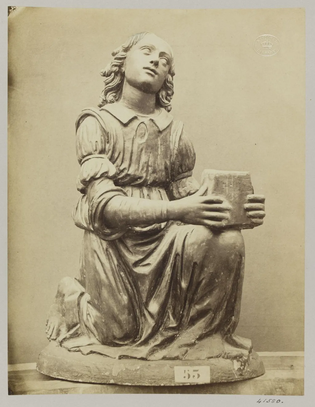 Figure of an angel on her knees in red terra cotta, by Louise Laffon, photographic, 1864