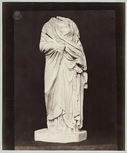 Marble statue of a headless draped figure, by Louise Laffon