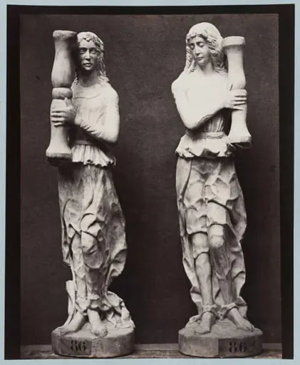 Marble statue of two angels holding torch bearers, by Louise Laffon