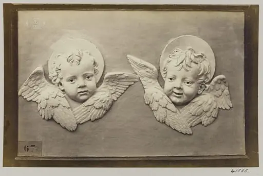 Two enamelled heads of seraphines, by Louise Laffon