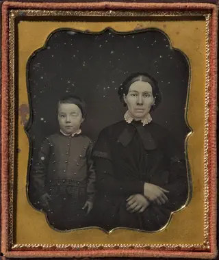 Mother with son with blind right eye