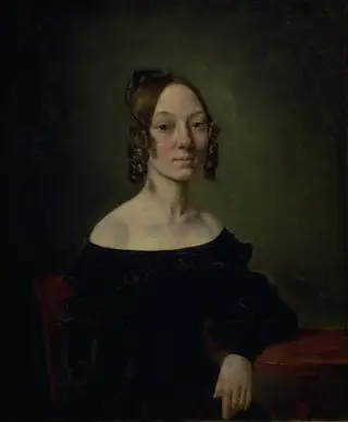 Portrait of a girl in a black dress sitting at table, by Wilhelm Bendz