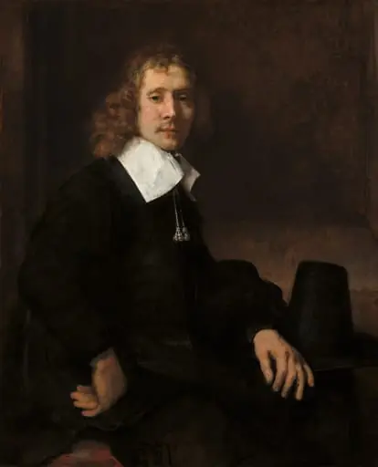 A Young Man Seated at a Table (possibly Govaert Flinck), by Rembrandt
