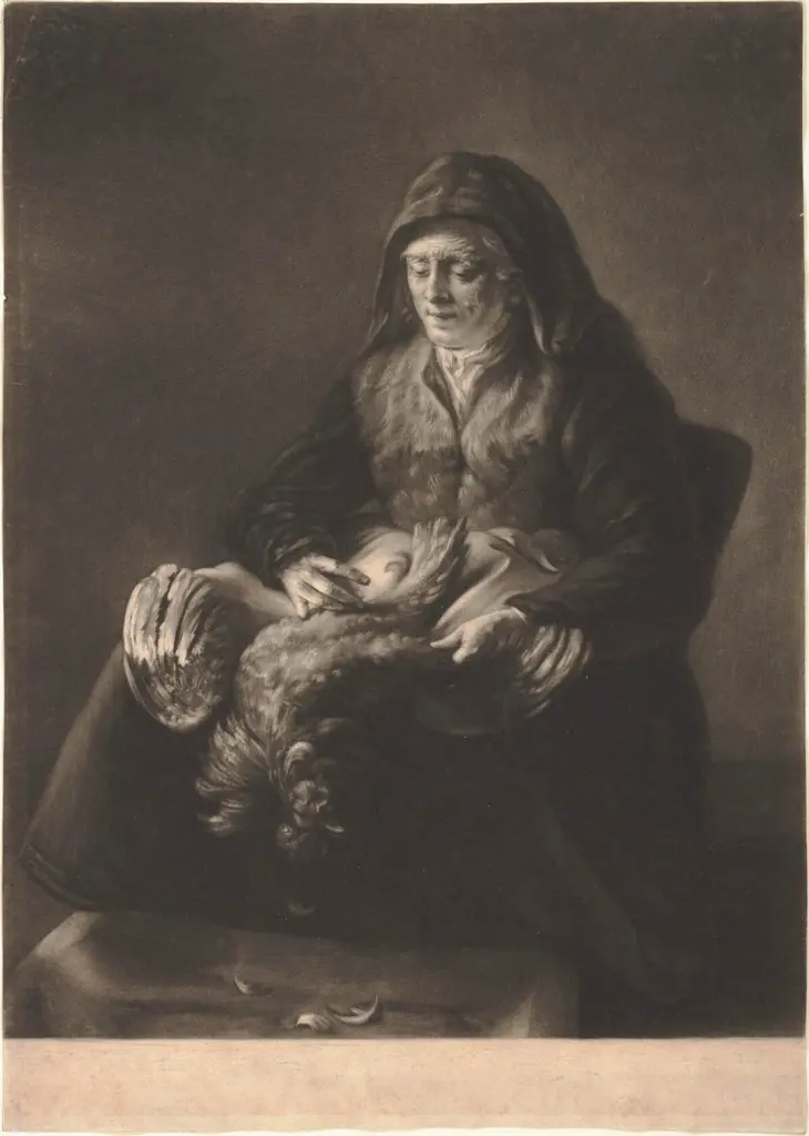 Woman plucking a fowl