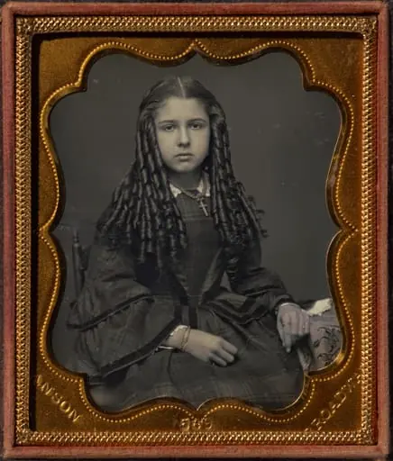 Teenage girl with bottle curls, by Rufus Anson