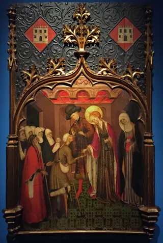 Santa Llúcia repartint almoines