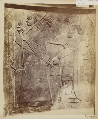 Sculpture depicting a royal Assyrian armsbearer with attendant genius from the period of Ashur-nasir-pal II (885-860 B.C.), Louvre, Paris