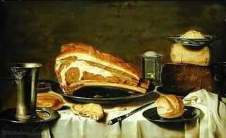 Still life of a laid table with cheese, meat and bread