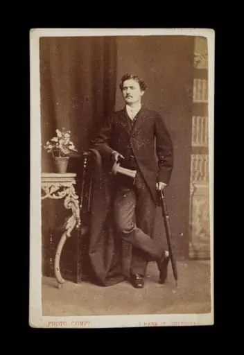 portrait of a man holding an umbrella and top hat, by The Sheffield Photographic Company