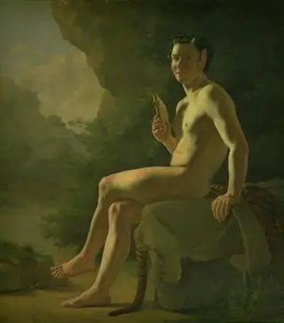 Ung Pan i en grotte. Modelfigur