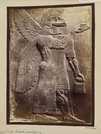 Assyrian sculpture of an eagle-headed genius, worshipping, Paris, Louvre, by Unknown