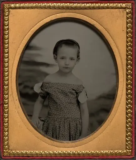 Child in off-shoulder polka dot dress, by Unknown