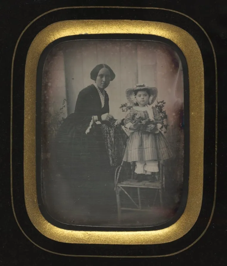 Child Standing on a Chair Holding Flowers, with Mother, by Unknown, 1855
