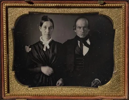 Parents of five children doing homework, by Unknown