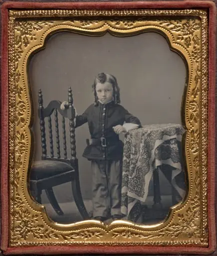 Standing boy with bottle curls, by Unknown