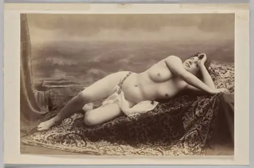 Untitled (reclining nude on carpet against painted backdrop of waves), by Unknown