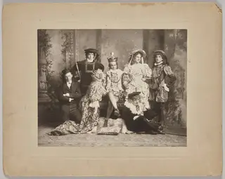 Untitled (theatrical scene with seven costumed figures)