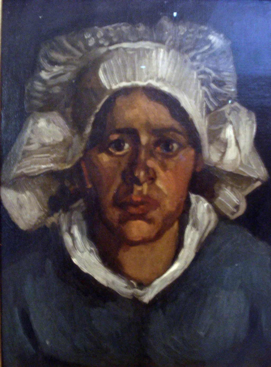 Head of a Peasant Woman with White Cap, by Vincent van Gogh, oil, 1885