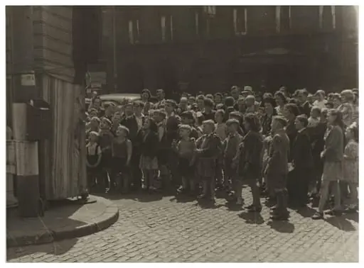 The audience at Professor Richard Codman lll's Punch and Judy booth, Liverpool, ca.1940, by Waldo S. Lanchester