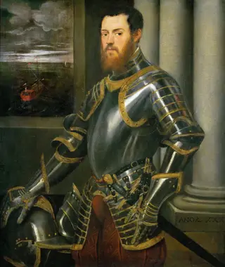 Young man in a gold-decorated suit of armour